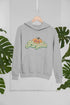 Hello Pumpkin Hoodie by Jade Thalassa, tropical setting mockup of a cozy pullover hoodie featuring pumpkin graphic design.