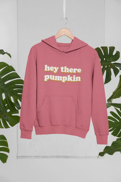 Jade Thalassa Hey There Pumpkin hoodie mockup featuring a hanging pullover hoodie in a tropical setting.