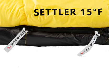 Triangulum Settler 15F camping sleeping bag with full-length zipper, suitable for outdoor camping and cold weather.