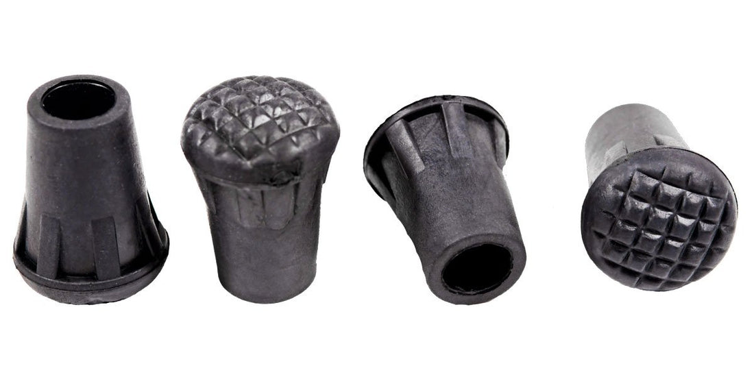 Set of four Triangulum trekking poles rubber tips for camping and hiking, shown attached to trekking pole ends.