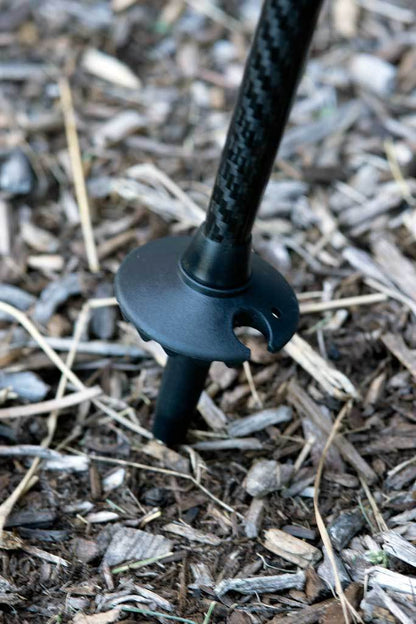 Triangulum trekking poles with 50mm mud and snow baskets, suitable for hiking and camping on rugged trails.