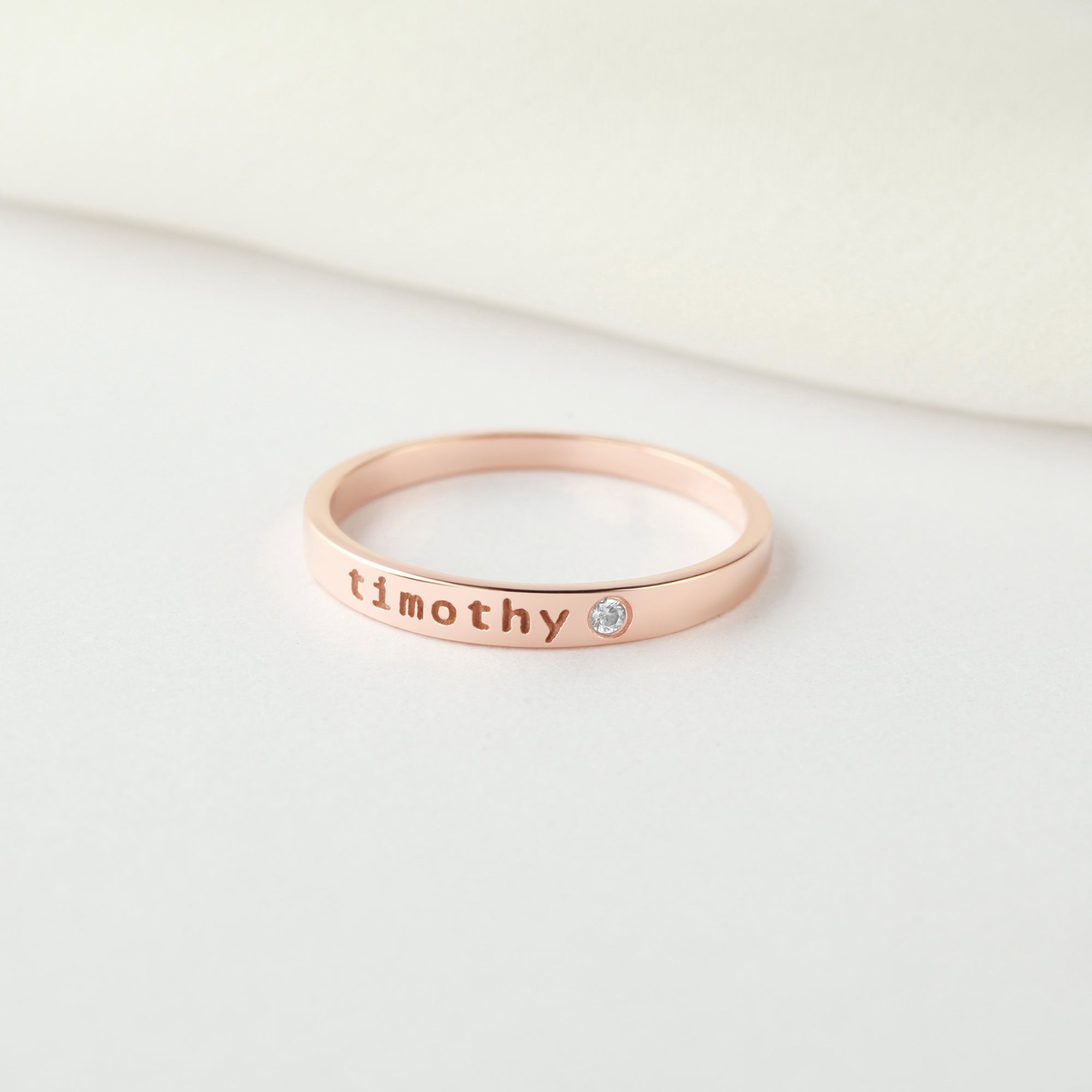 Green Millie personalized name ring with embedded birthstone, stackable mom ring featuring custom engraved name.