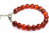 Faceted Carnelian stone bracelet by Silver Hestia showing warm orange-red beads on a delicate silver chain.