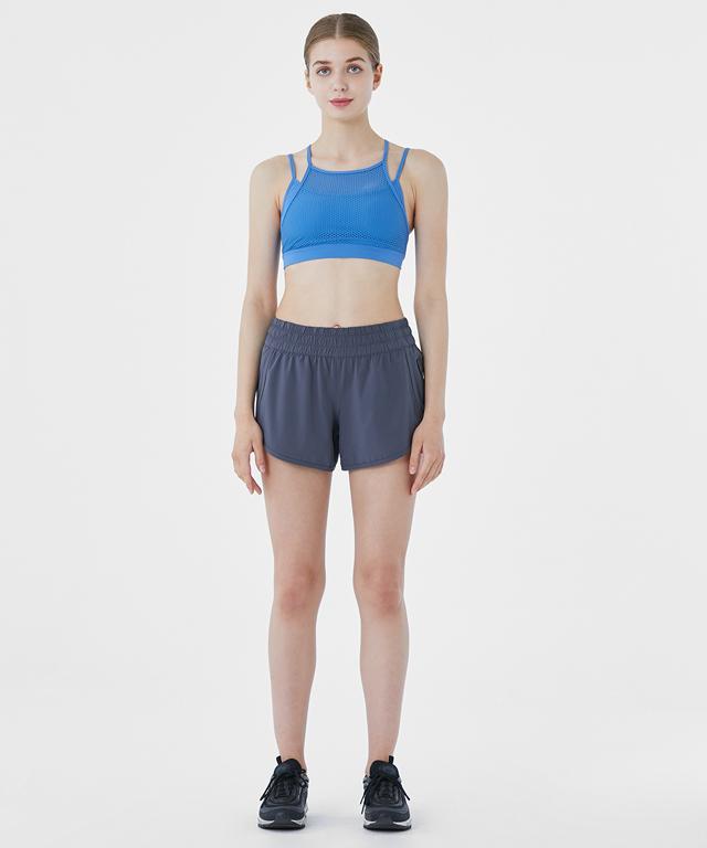 Women’s All The Time Shorts by Amethyst Lucy, casual denim shorts with a relaxed fit and distressed details, worn by a model.