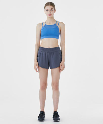 Women’s All The Time Shorts by Amethyst Lucy, casual denim shorts with a relaxed fit and distressed details, worn by a model.