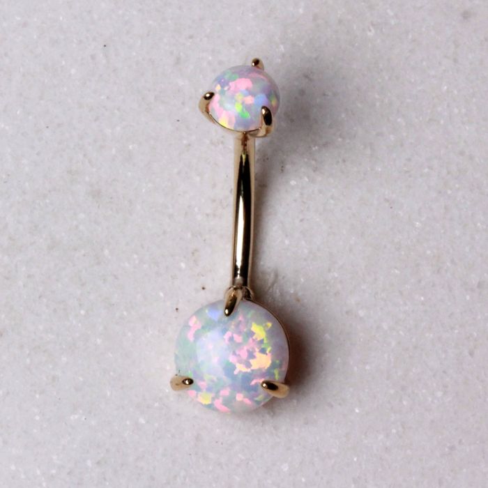 14K yellow gold navel ring with prong-set white synthetic opal, jewelry and watch accessory featuring a polished gold finish.