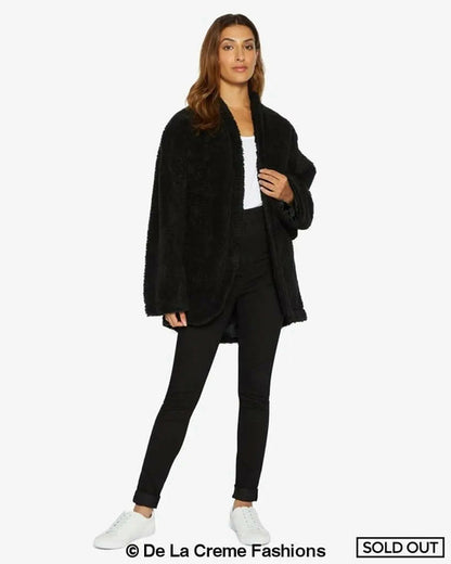 Black open-front belted teddy coat by Rose Eleusis, cozy and stylish jacket with a relaxed fit and belt detail.