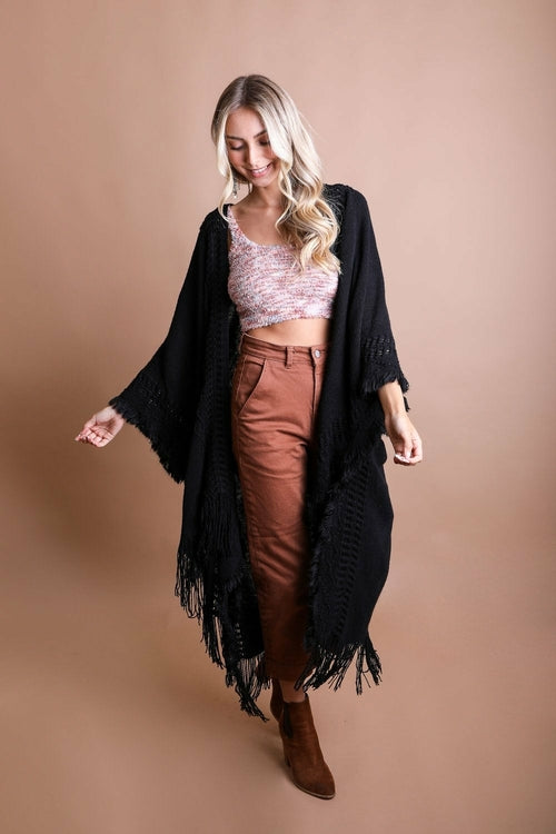 Black open-work bohemian ruana with frayed edges, featuring a lightweight, airy design by Periwinkle Aether accessories.