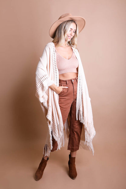 Open work frayed bohemian ruana accessory by Periwinkle Aether, featuring lightweight open-knit fabric with fringed edges.