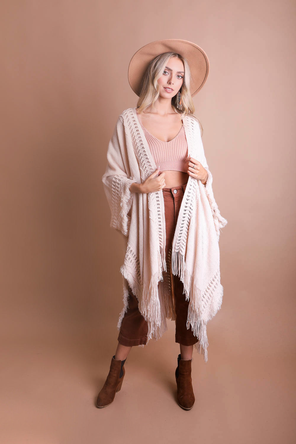 Open work frayed bohemian ruana accessory by Periwinkle Aether, featuring a lightweight, airy design with frayed edges and boho style.