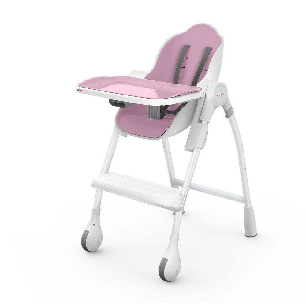Ultramarine Dione Oribel Cocoon baby high chair for infants and toddlers, featuring a child seated in a modern dining chair.