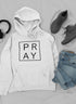 Jade Thalassa Pray Hoodie in casual outfit with trendy sneakers and jeans, displayed as a mockup on a model.