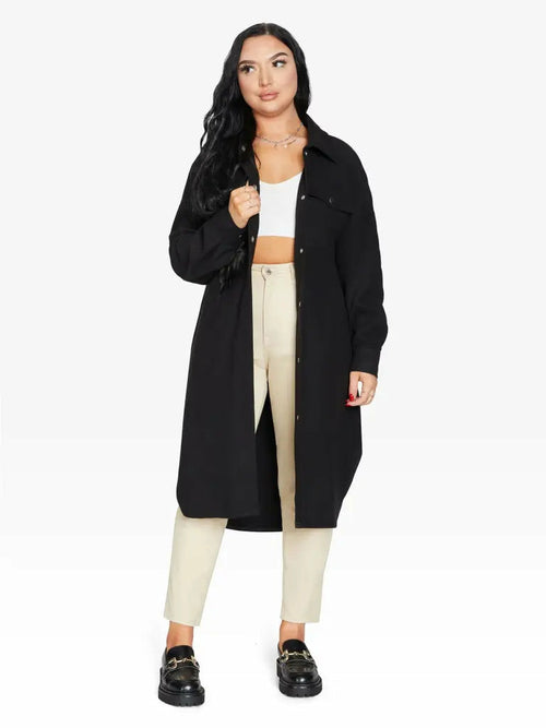 Black oversized longline shacket by Rose Eleusis, relaxed fit jacket with a casual style, suitable for UK sizes 8-14.