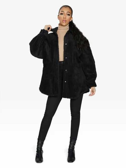 Black oversized patch pocket Borg teddy shacket by Rose Eleusis, featuring a cozy, plush texture and relaxed fit for casual wear.