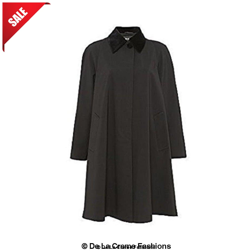 Black Rose Eleusis oversized velvet-trim lightweight swing coat hanging on a rack, showcasing its relaxed fit and elegant design.