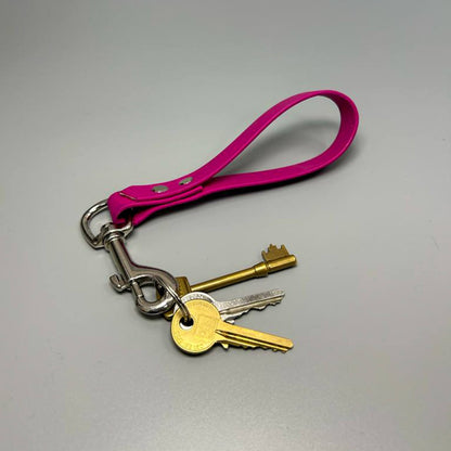 Scarlet Nyx BioThane key ring with colorful patch design attached to a keychain, durable and stylish accessory.
