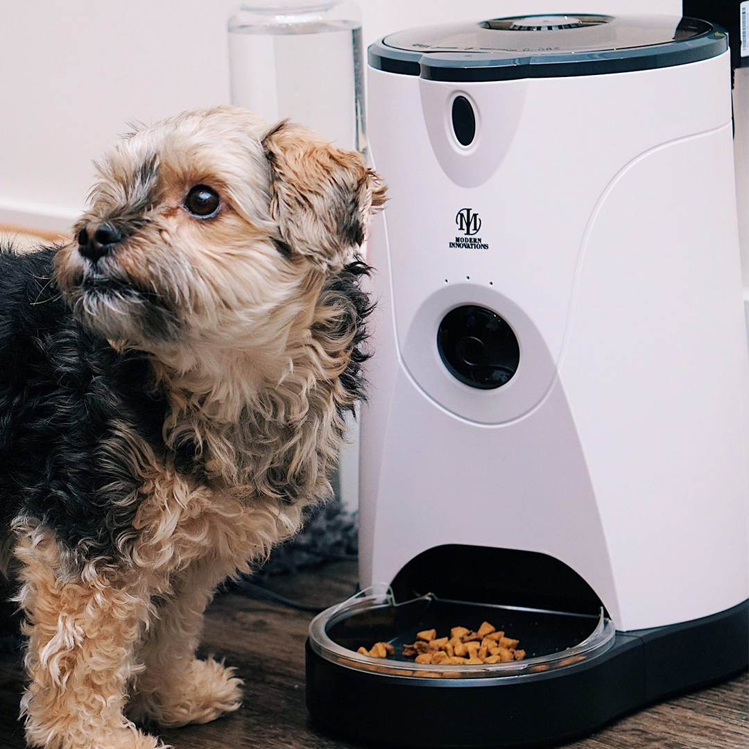 Pink Trillium WiFi pet feeder for petcare, showing the device with food tray and digital display for remote feeding control.