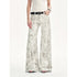 Black snake print flared denim trousers by Brown Coeus featuring a high waist and stylish fit.