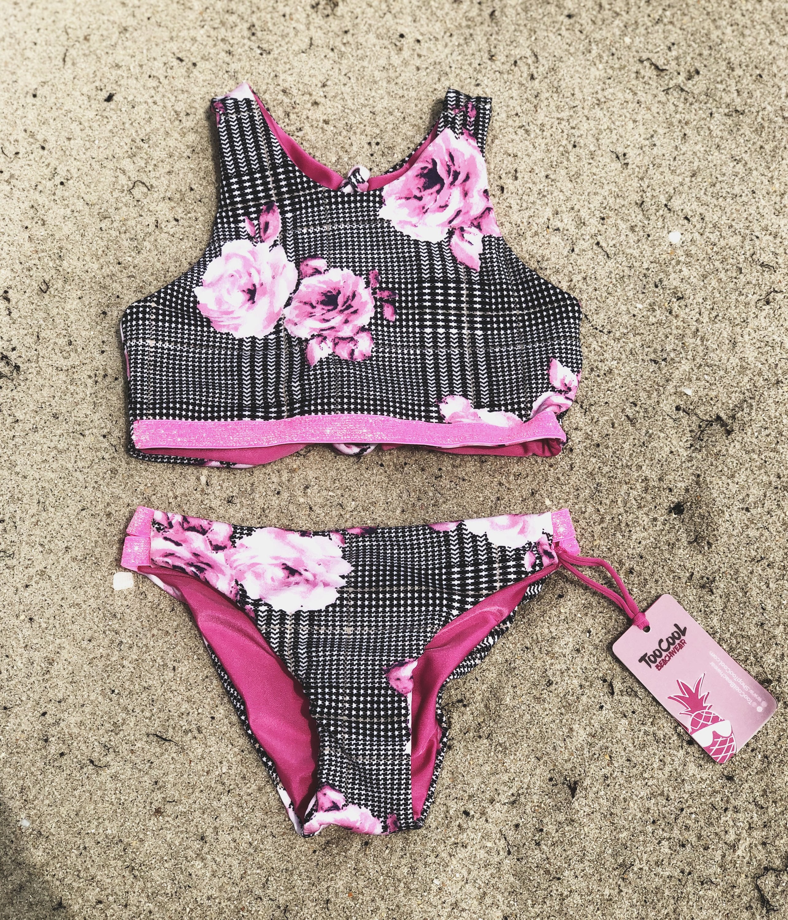 Bright pink Bikini from Bronze Tartarus for kids, featuring a playful, colorful design perfect for summer swimwear.