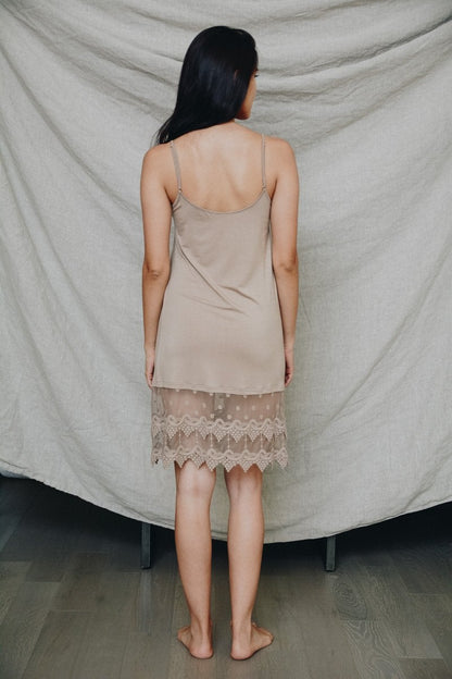 Polkadot lace slip dress by Periwinkle Aether featuring a delicate lace design and a classic polka dot pattern.