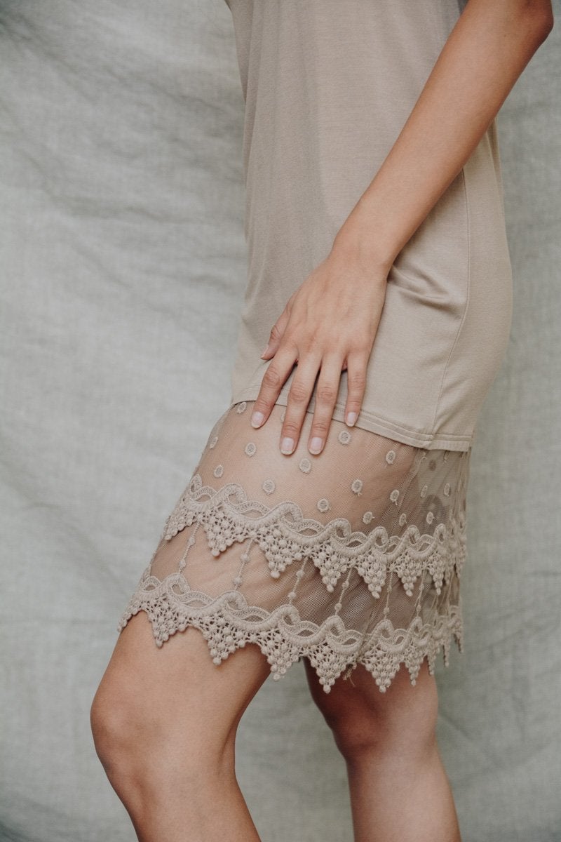 Polkadot lace slip dress by Periwinkle Aether featuring delicate lace details and a stylish polka dot pattern.