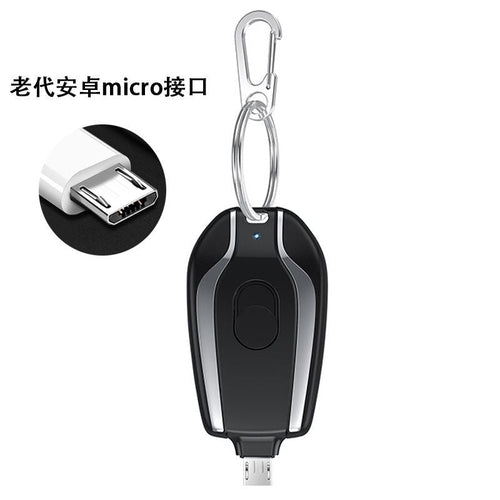 Taupe Gaia portable mini rechargeable power bank with built-in plug, compact tech accessory for on-the-go device charging.