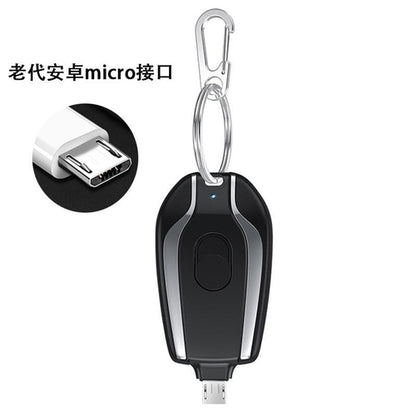 Taupe Gaia portable mini rechargeable power bank with built-in plug, compact tech accessory for on-the-go device charging.
