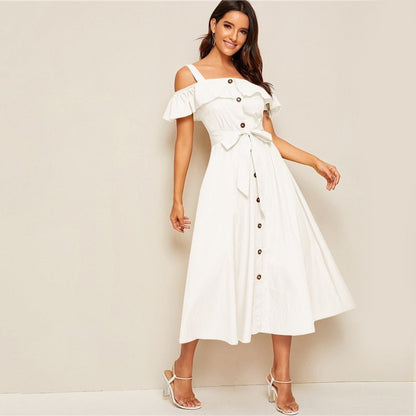 White button-down MIDI dress with a fresh tie waist by Jade Iapetus, shown hanging on a wooden background.