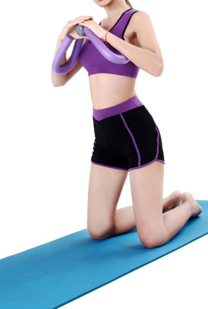 Yellow Pandora thigh and arm exercise muscle strengthening flexor device for resistance training and muscle toning.