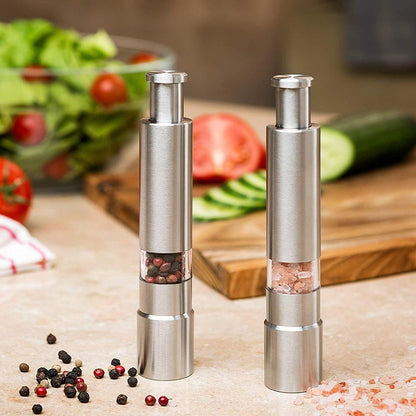 Yellow Pandora stainless steel salt and pepper spice grinder for kitchen use, with adjustable grind settings and modern design.