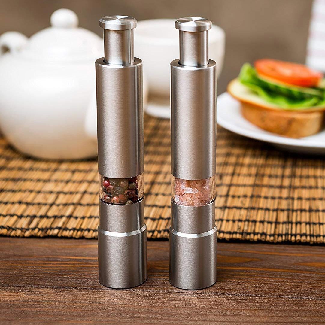 Yellow Pandora premium stainless steel salt and pepper spice grinder for kitchen use, featuring a sleek modern design.