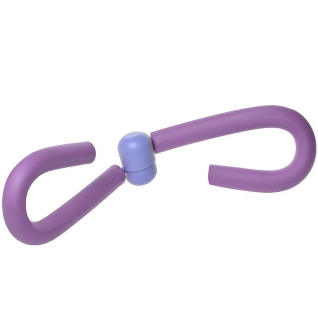 Yellow Pandora thigh and arm exercise muscle strengthening flexor device for toning and resistance training.