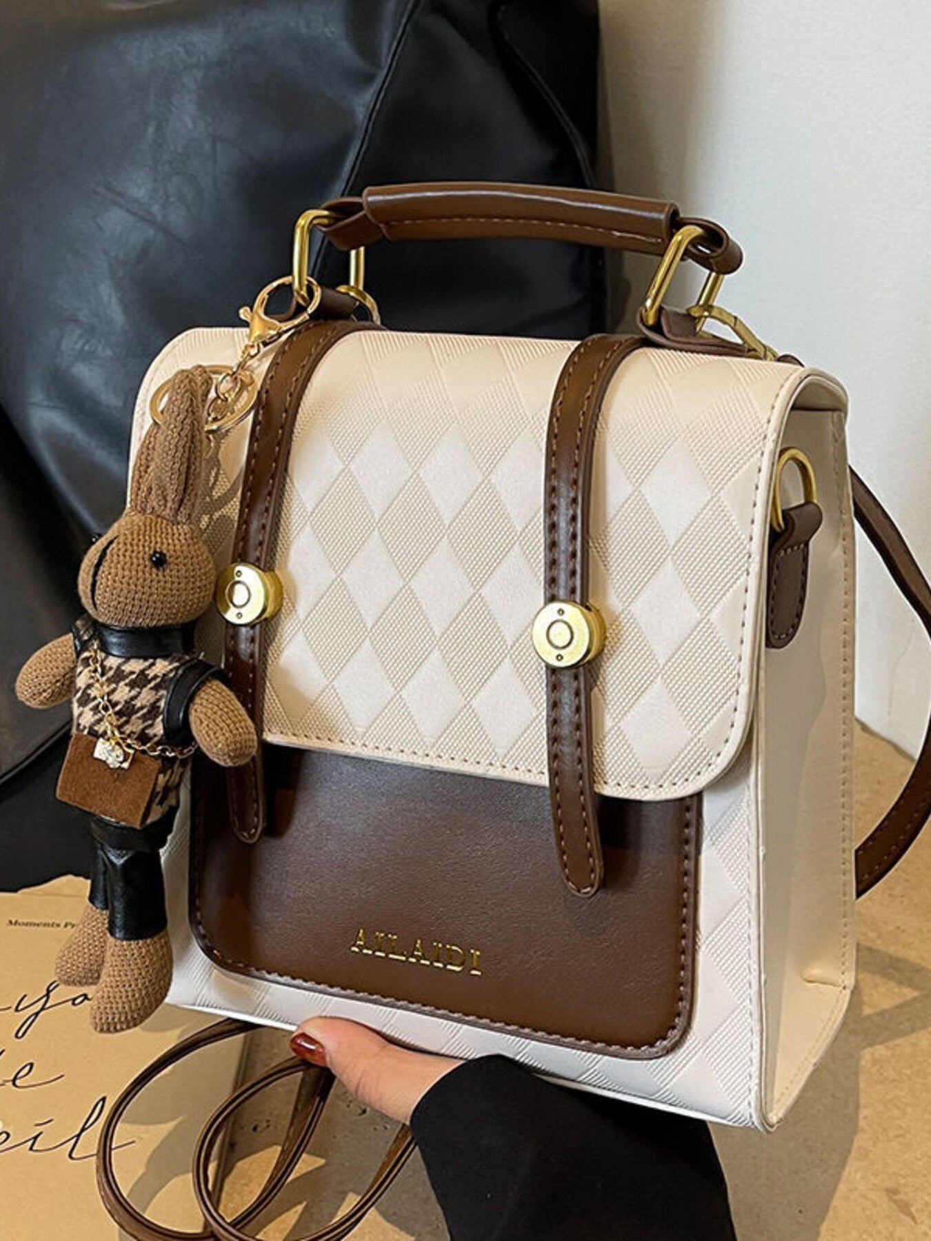 Taupe Gaia quilted flap backpack bag for women, featuring a stylish quilted design and adjustable straps.