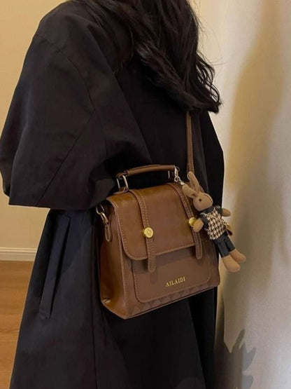 Taupe Gaia quilted flap backpack bag for women, stylish and functional with a modern design and adjustable straps.
