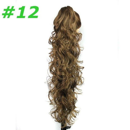 Blue Charlie synthetic curly and wavy clip-in ponytail for women, shown attached with a claw clip style.