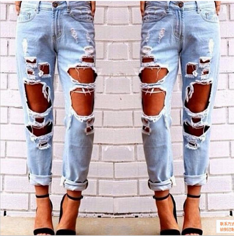 Blue Charlie ripped denim joggers for women with knee holes, slim fit and blue color, ideal for casual wear.