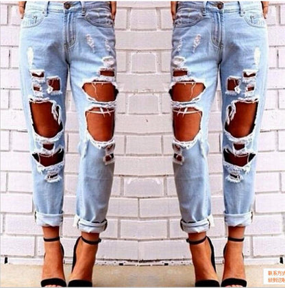 Blue Charlie ripped denim joggers for women with knee holes, slim fit and blue color, ideal for casual wear.