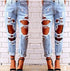 Blue Charlie ripped denim joggers for women with knee holes, slim fit and blue color, ideal for casual wear.