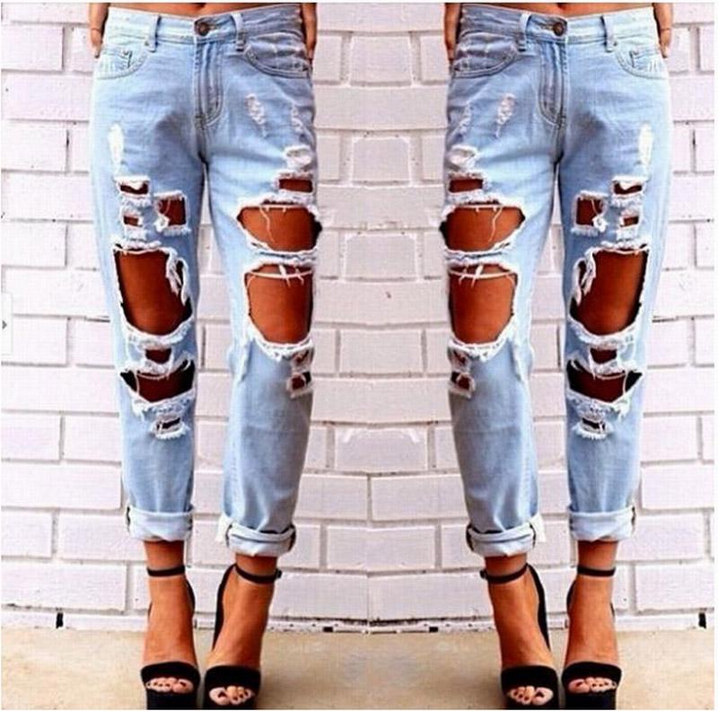 Blue Charlie ripped denim joggers for women with knee holes, slim fit blue jeans, casual and stylish for everyday wear.