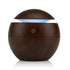 Jade USB ultrasonic cool mist humidifier with 7 color-changing LED lights, designed for portable air purification and moisture.