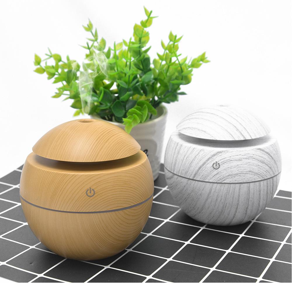 Jade USB ultrasonic cool mist humidifier with 7 color-changing LED lights, designed for air purification and moisture.