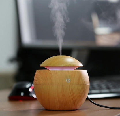 Jade USB ultrasonic cool mist humidifier with 7 color-changing LED lights, designed for home air purification and moisture.