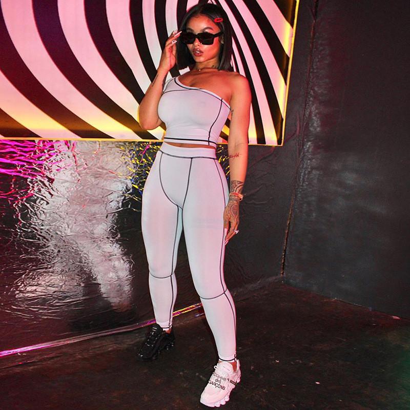 Striped patchwork sporty matching set for women by Blue Charlie, featuring a one-shoulder crop top and matching shorts.