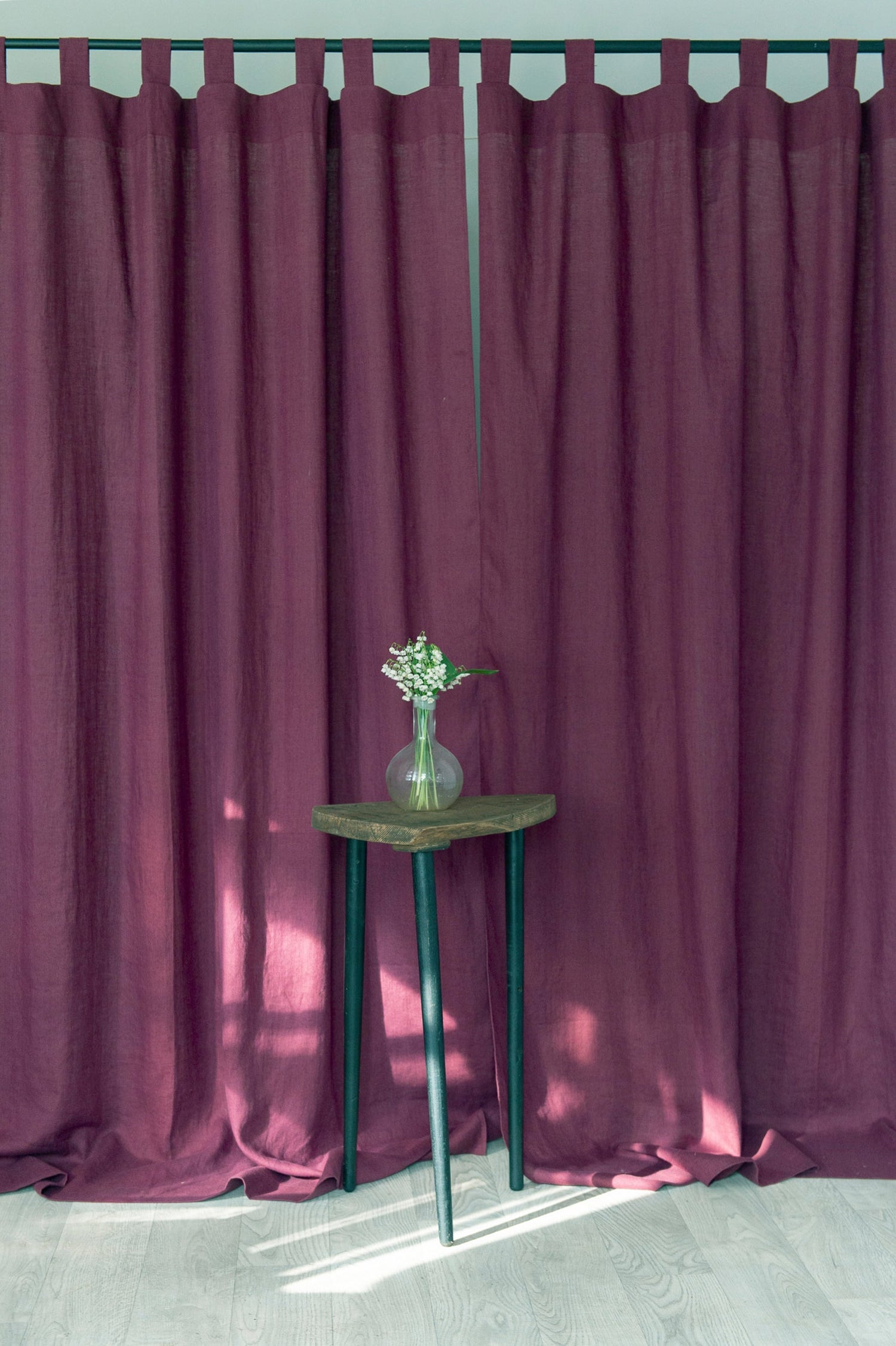 Dark plum linen curtain with tab top design from Magenta Sugarplum, showing the textured fabric and stylish window treatment.