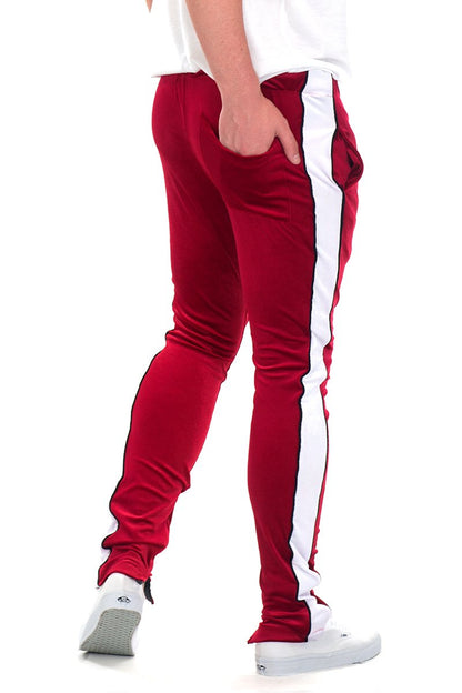 Lime Milo velvet pants with side stripe piping and ankle zippers, stylish joggers with a tapered fit and comfortable design.