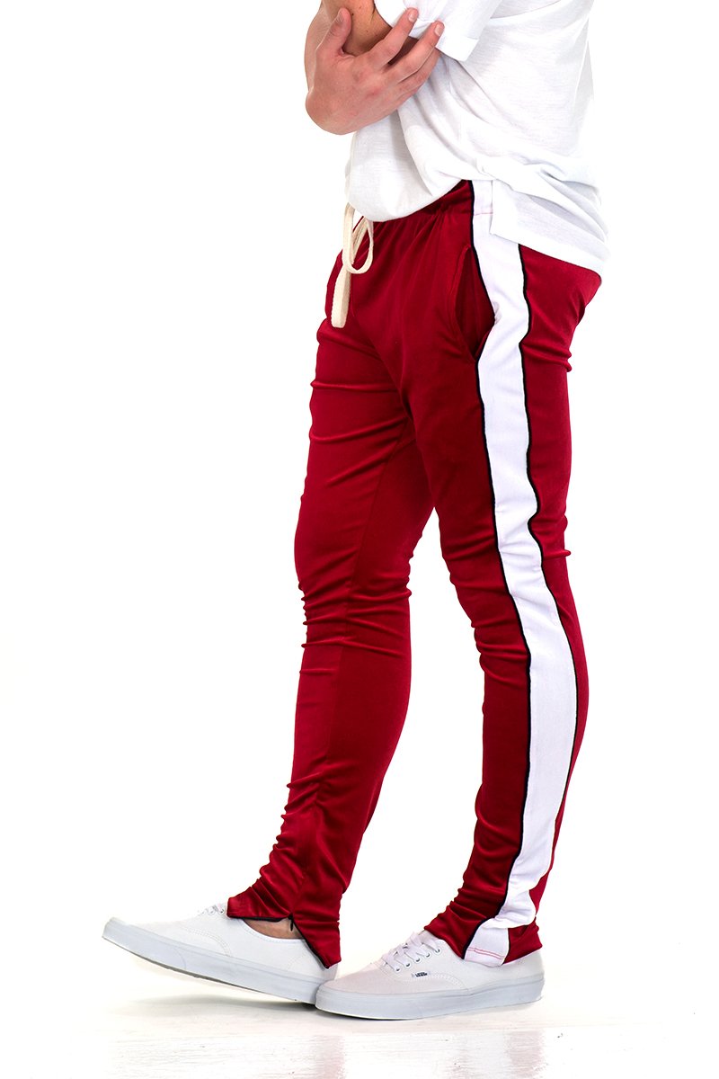 Lime Milo velvet pants with side stripe piping, ankle zippers, and jogger style, shown with a relaxed fit and stylish design.