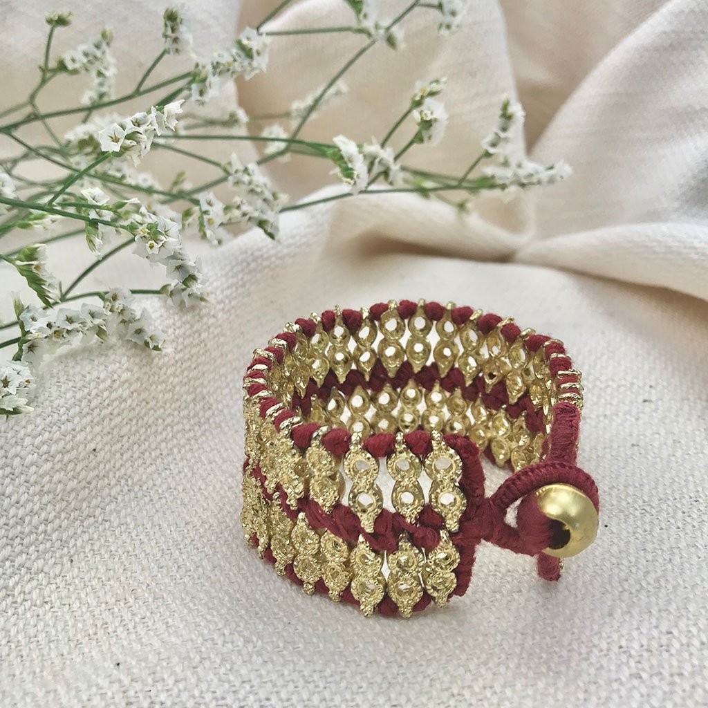 Red gold Riya cuff bracelet by Ariel featuring a bold statement design, perfect for stylish wrist accessories.