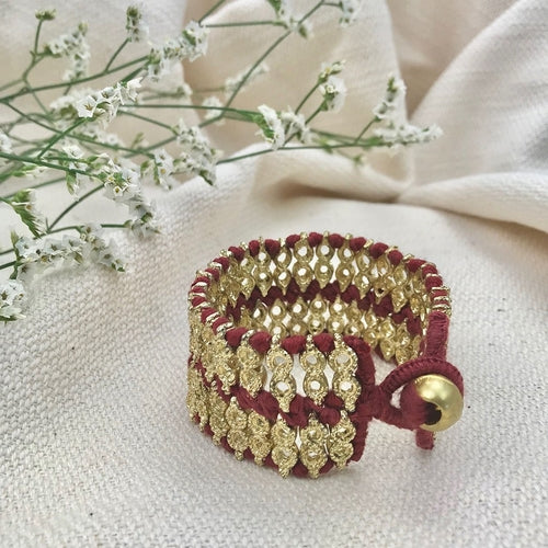 Ariel Riya Cuff Bracelet in bold red and gold, featuring a statement design with intricate detailing.