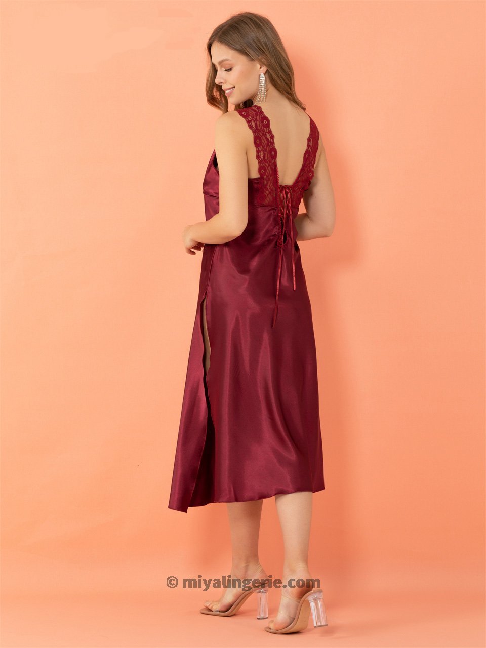 Red high slit nightie dress by Harlequin Icarus, flowing fabric, sleeveless design, perfect for elegant evening wear.