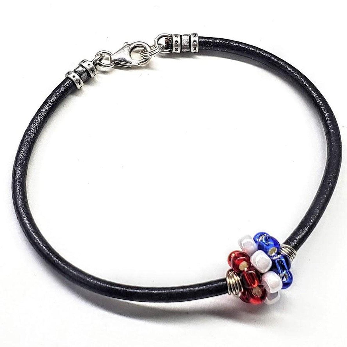Red, white, and blue beaded leather bracelet by Blue Crius, patriotic-style jewelry for men and women.